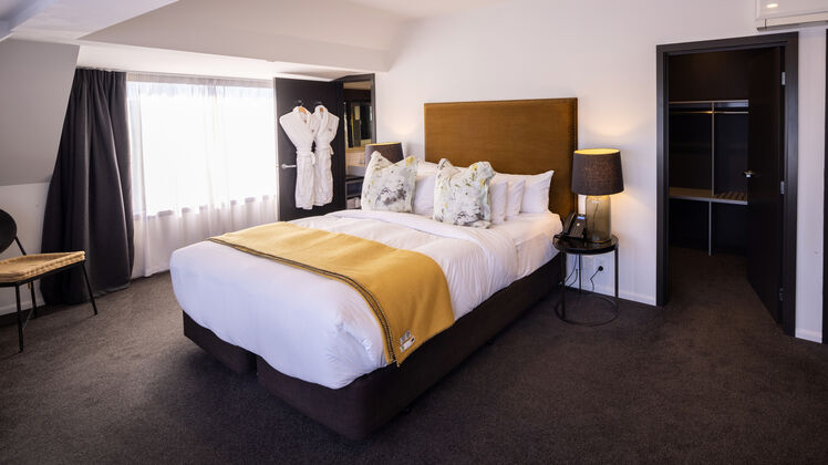 Sink into sumptuous bedding in Hotel Montreal’s Christchurch luxury apartments. Master bedroom in the penthouse suite.